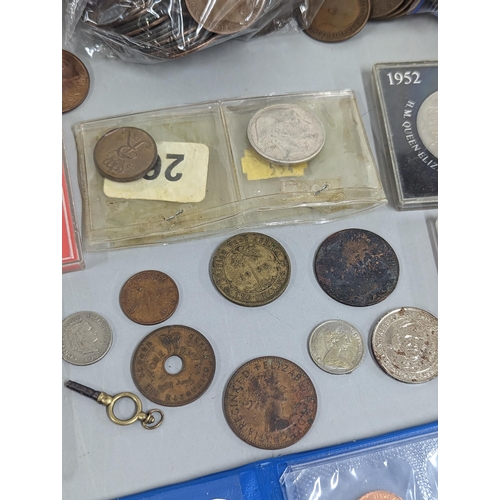 12 - A mixed lot of British and world coinage to include commemorative Crowns, 1951, Churchill and others... 