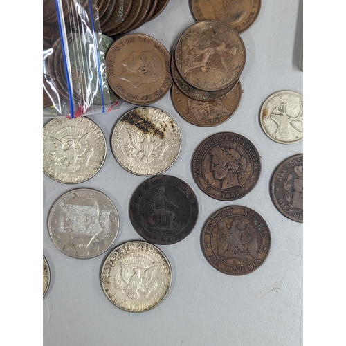 12 - A mixed lot of British and world coinage to include commemorative Crowns, 1951, Churchill and others... 