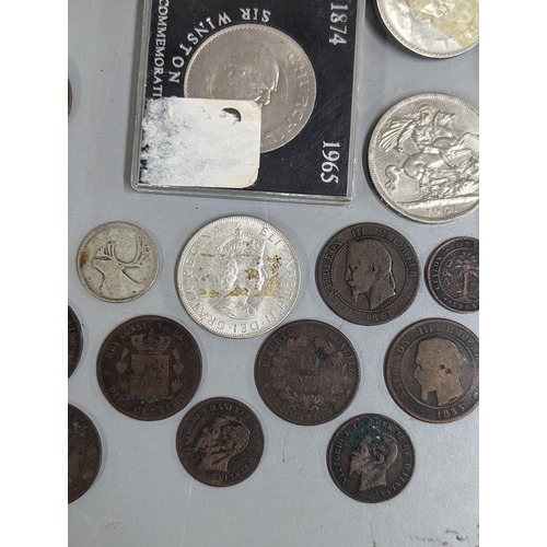 12 - A mixed lot of British and world coinage to include commemorative Crowns, 1951, Churchill and others... 