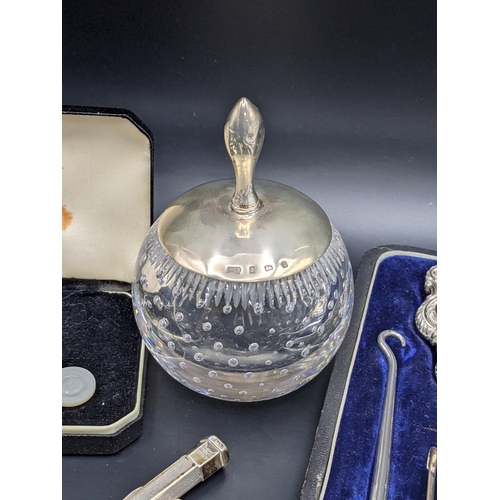 134 - A mixed lot of silver and silver plated items to include a silver top match striker, silver cuff lin... 