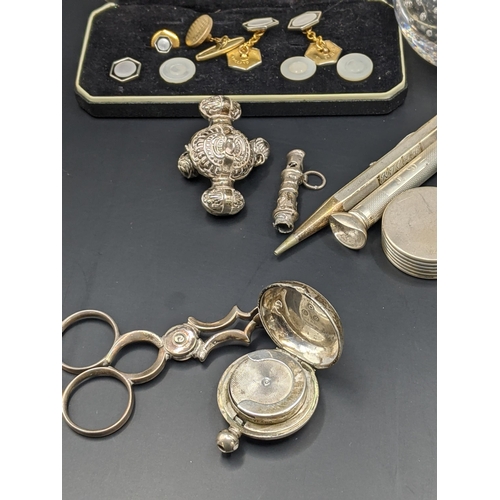 134 - A mixed lot of silver and silver plated items to include a silver top match striker, silver cuff lin... 