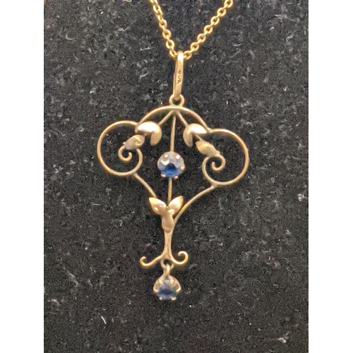 151 - A late 19th/early 20th century 9ct gold necklace and pendant set with blue paste stones, total weigh... 