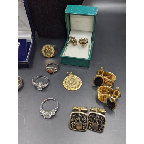 159 - A mixed lot of costume jewellery to include gold plated horse shoe cufflinks, and others and a sterl... 