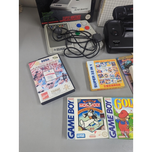 191 - Mixed vintage game systems and games to include a boxed Nintendo Game Boy with Alex Kidd in Miracle ... 