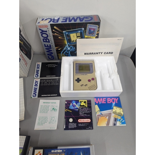 191 - Mixed vintage game systems and games to include a boxed Nintendo Game Boy with Alex Kidd in Miracle ... 