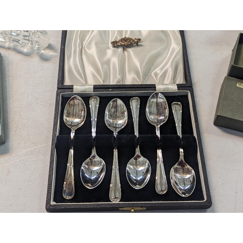 195 - Silver plate to include a tea set, flatware, silver handled knives, a magnifying glass and other ite... 