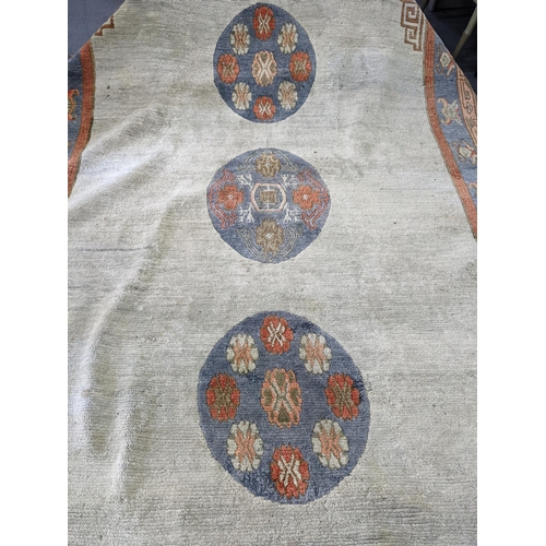 206 - A handmade Chinese carpet with geometric motifs in pastel colours
Location:A1B