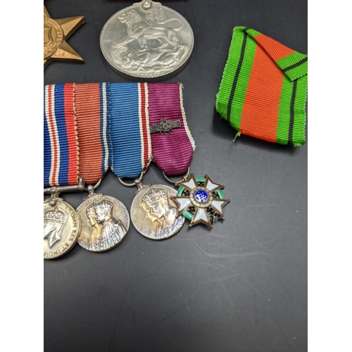 231 - WWI and later miniatures to include Legion of Merit, Distinguished service order, military MBE and o... 