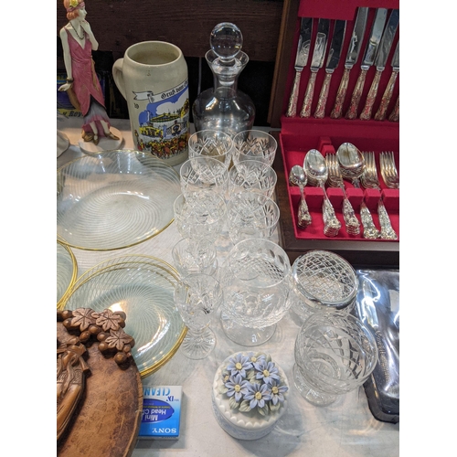 235 - A large mixed lot to include silverplated trays and others, a canteen of cutlery porcelain figurines... 