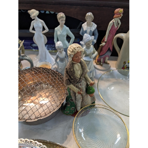 235 - A large mixed lot to include silverplated trays and others, a canteen of cutlery porcelain figurines... 