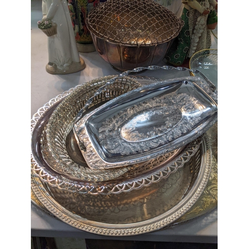 235 - A large mixed lot to include silverplated trays and others, a canteen of cutlery porcelain figurines... 