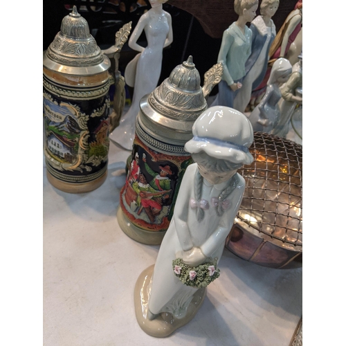 235 - A large mixed lot to include silverplated trays and others, a canteen of cutlery porcelain figurines... 