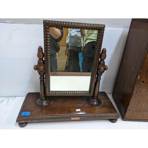 241 - A 19th century mahogany dressing table swing mirror having a beaded border and turned feet, 47cm h x... 