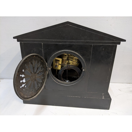 242 - A Victorian black slate 8-day mantel clock of architectural design, the dial signed J.D Fisher Paris... 