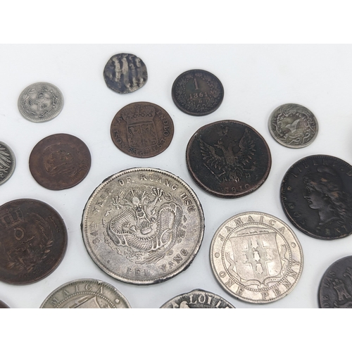 26 - A mixed group of 19th century and other world coinage to include a Japanese Meji one yen, 1848 Isabe... 