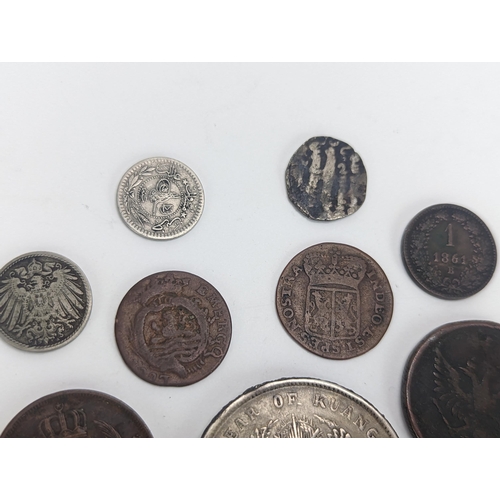 26 - A mixed group of 19th century and other world coinage to include a Japanese Meji one yen, 1848 Isabe... 