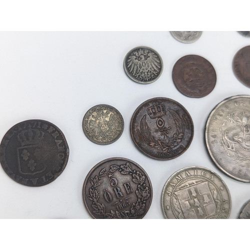 26 - A mixed group of 19th century and other world coinage to include a Japanese Meji one yen, 1848 Isabe... 