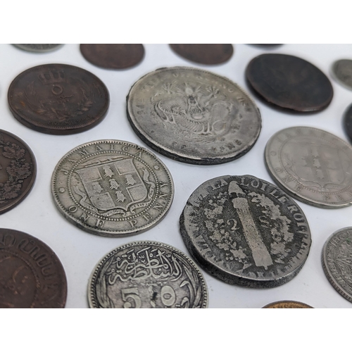 26 - A mixed group of 19th century and other world coinage to include a Japanese Meji one yen, 1848 Isabe... 