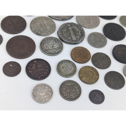 26 - A mixed group of 19th century and other world coinage to include a Japanese Meji one yen, 1848 Isabe... 