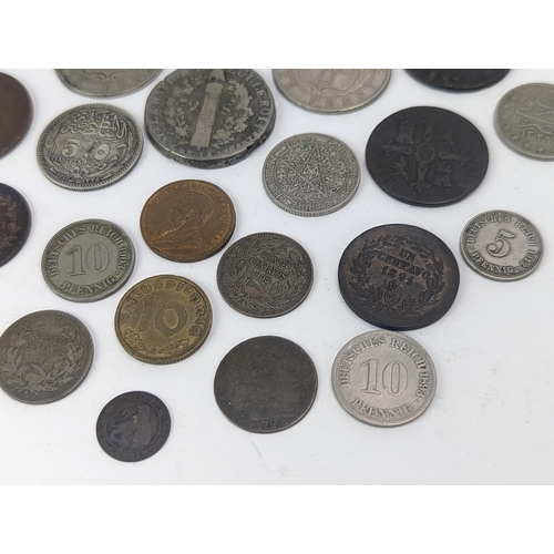 26 - A mixed group of 19th century and other world coinage to include a Japanese Meji one yen, 1848 Isabe... 