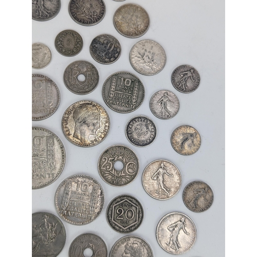 27 - A group of late 19th/early 20th century silver and other coinage to include 1872 one Franc, 1872 50 ... 