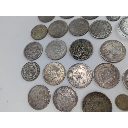 29 - A group of Replica coins to include 1833 Russian Rubel, 'Junk Dollar', 1879 Goloid 100 cents, 1911 T... 