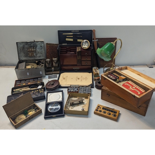 320 - A mixed lot to include an early 20th century travel stationary A/F, brass lamp, vintage tins, Egypti... 