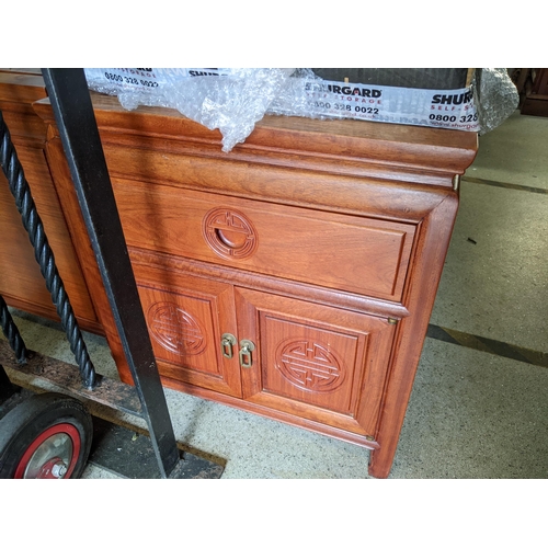 322 - A pair of late 20th century teak cabinets each with a drawer and pair of panelled doors
Location:LAB