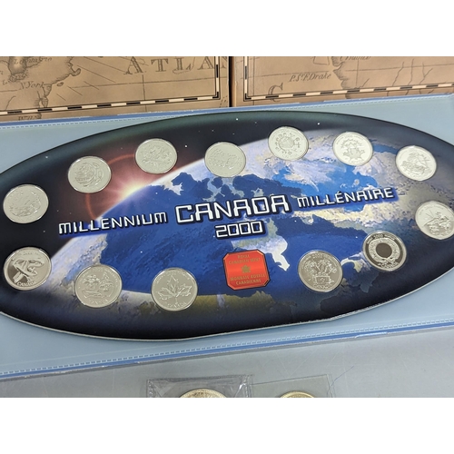 39 - A collection of North American commemorative coins to include a 1964 Canada Charlottetown silver dol... 