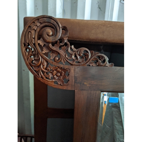 401 - A large Chinese carved hardwood framed mirror with floral ornament, 200cm x 159cm
Location:CON