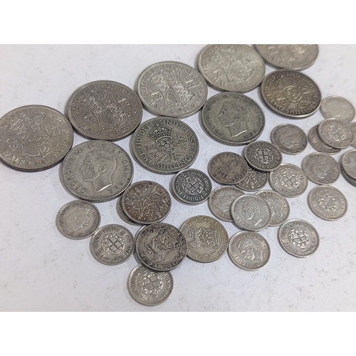 42 - A group of British pre-1947 coinage to include Half-Crowns, Florins, Sixpence, and threepence, 161.2... 