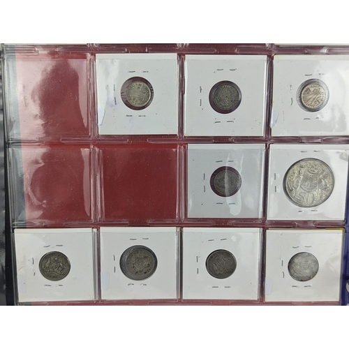 46 - An album of mixed world silver coinage to include a 1912 British Trade Dollar, 1861-1908 Chinese Don... 