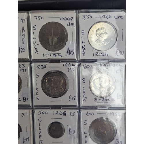 46 - An album of mixed world silver coinage to include a 1912 British Trade Dollar, 1861-1908 Chinese Don... 