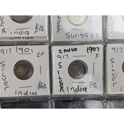 46 - An album of mixed world silver coinage to include a 1912 British Trade Dollar, 1861-1908 Chinese Don... 