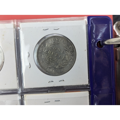 46 - An album of mixed world silver coinage to include a 1912 British Trade Dollar, 1861-1908 Chinese Don... 