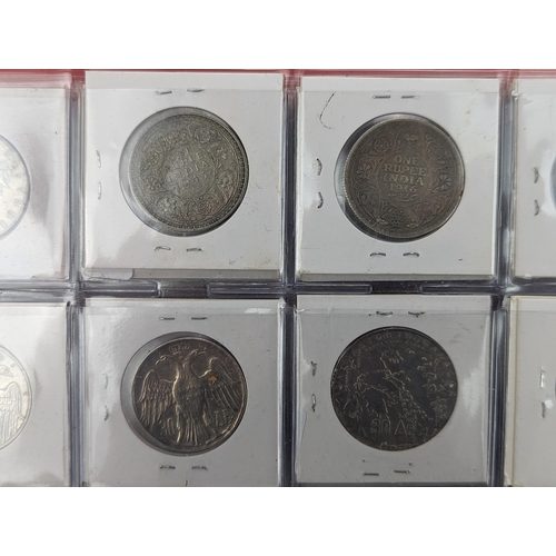 46 - An album of mixed world silver coinage to include a 1912 British Trade Dollar, 1861-1908 Chinese Don... 