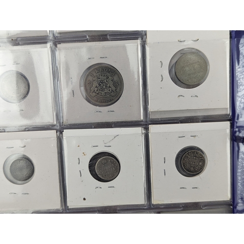 46 - An album of mixed world silver coinage to include a 1912 British Trade Dollar, 1861-1908 Chinese Don... 