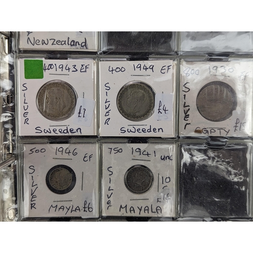 46 - An album of mixed world silver coinage to include a 1912 British Trade Dollar, 1861-1908 Chinese Don... 