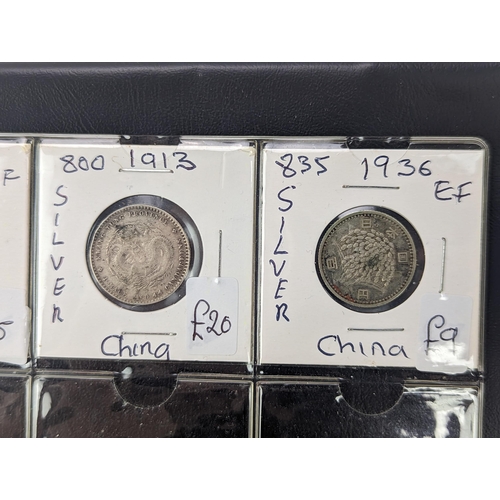 46 - An album of mixed world silver coinage to include a 1912 British Trade Dollar, 1861-1908 Chinese Don... 