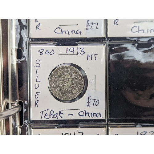 46 - An album of mixed world silver coinage to include a 1912 British Trade Dollar, 1861-1908 Chinese Don... 