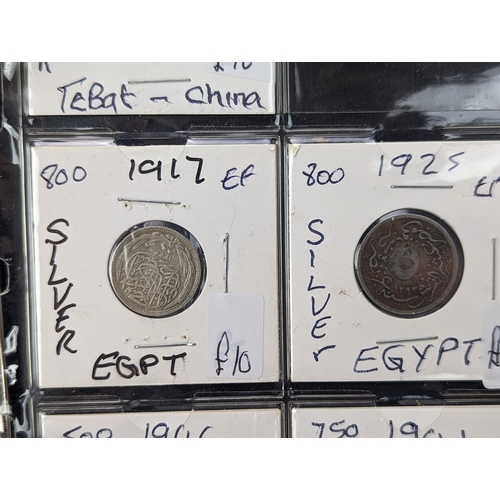 46 - An album of mixed world silver coinage to include a 1912 British Trade Dollar, 1861-1908 Chinese Don... 