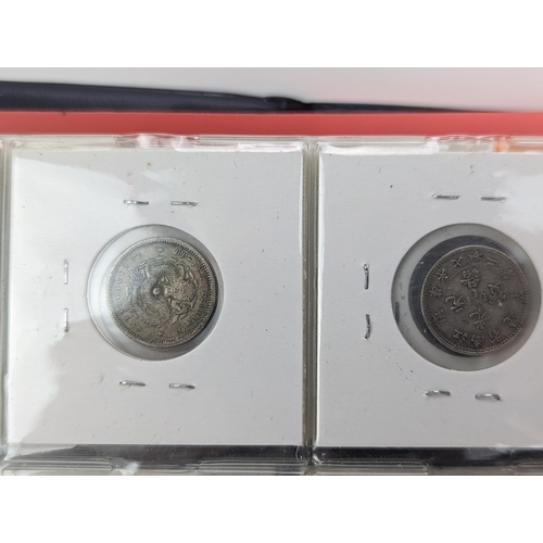 46 - An album of mixed world silver coinage to include a 1912 British Trade Dollar, 1861-1908 Chinese Don... 