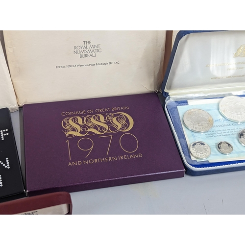 54 - A collection of proof sets to include First National coinage  of Barbados 1973, First Coinage of the... 