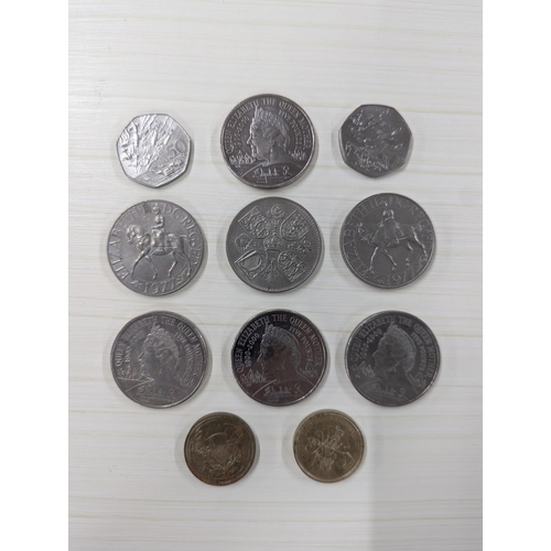 55 - A group of commemorative coins to include the 1972 Cayman Islands sterling silver 25 dollars specime... 