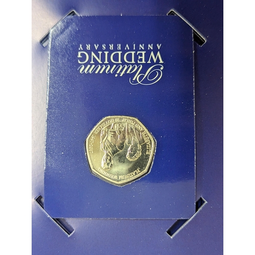 58 - A Queen Elizabeth II fifty pence coin collection binder, containing approximately forty five 50p's t... 