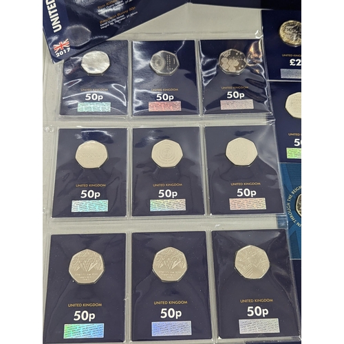 64 - A mixed collection of coins to include 2017 Beatrix Potter 50p coin collecting pack, 2018 coin colle... 