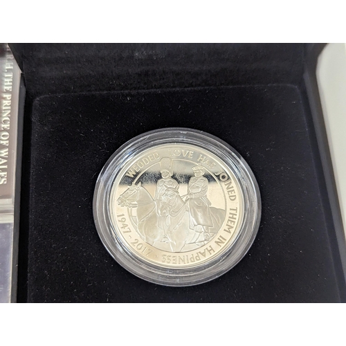 65 - A large group of coins to include Westminster Elizabeth II and Prince Philip Numis proof crowns, Ico... 