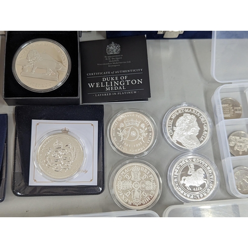 65 - A large group of coins to include Westminster Elizabeth II and Prince Philip Numis proof crowns, Ico... 