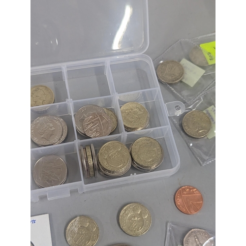 67 - Mixed coins to include a collection of £1 coins, commemorative crown/£5 coins, 50p and 10ps along wi... 