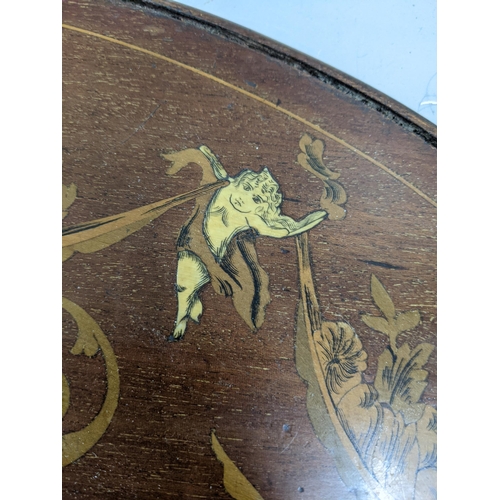 107 - A Victorian inlaid and marquetry twin handled tray
Location:A4B